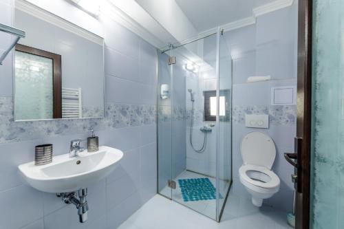 Ванна кімната в Vila Yna