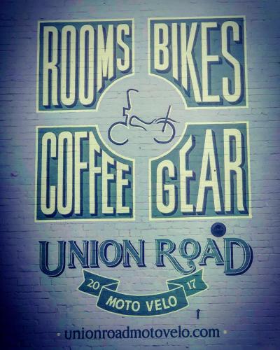 a sign that reads roots bikes coffee star union road at Union Road Moto Velo Accommodation in Crediton