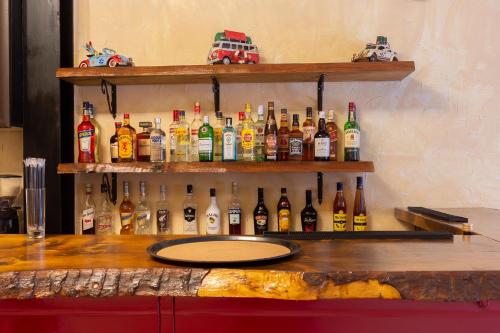 a bar with a bunch of bottles of alcohol at Narkissos 'SUPERB' in Chania Town