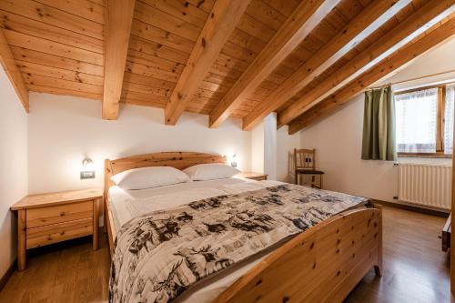 Кровать или кровати в номере Villetta Val Di Sole