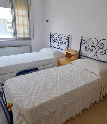 Cama o camas de una habitación en Donatella Mare