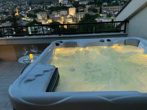 a jacuzzi tub on top of a building at Penthouse with Old bridge view and jacuzzi in Mostar