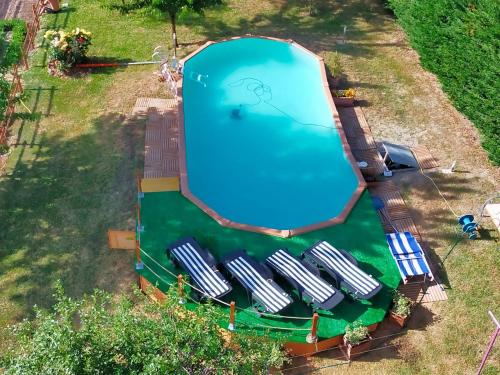 an overhead view of a large swimming pool in a yard at MANSARDA VITI - Sguardo su Frontone - in Frontone
