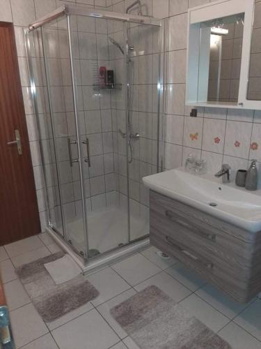 a bathroom with a shower and a sink at Apartmani Vodice I in Vodice