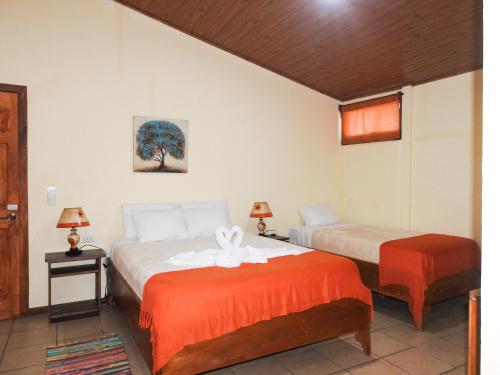 Ένα ή περισσότερα κρεβάτια σε δωμάτιο στο Hotel Casa Madonna