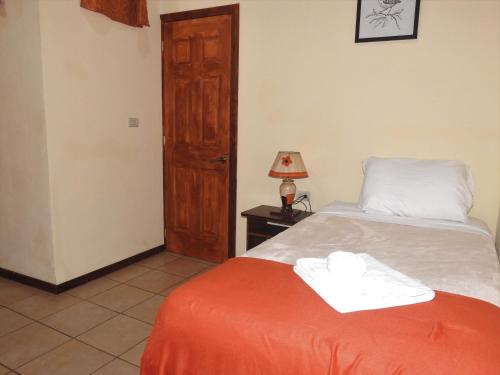 Ένα ή περισσότερα κρεβάτια σε δωμάτιο στο Hotel Casa Madonna