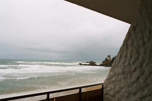 a view of the ocean from a balcony at Carlina Lodge in Biarritz