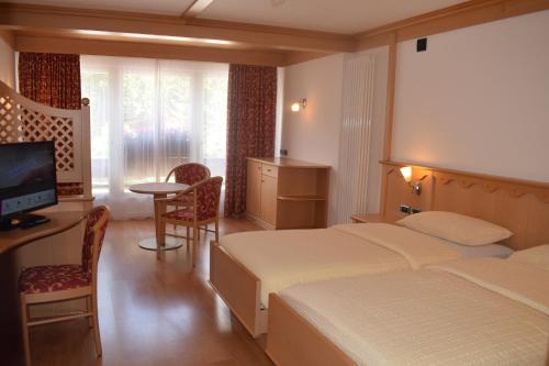 Ένα ή περισσότερα κρεβάτια σε δωμάτιο στο Hotel Crepes de Sela