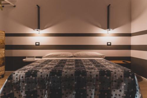 Ένα ή περισσότερα κρεβάτια σε δωμάτιο στο Il Limoneto Rooms