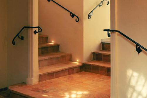a set of stairs with lights on them at Hotel la Ponche in Saint-Tropez