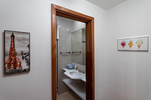 a bathroom with a sink and a mirror at Residence Real Copacabana in Rio de Janeiro