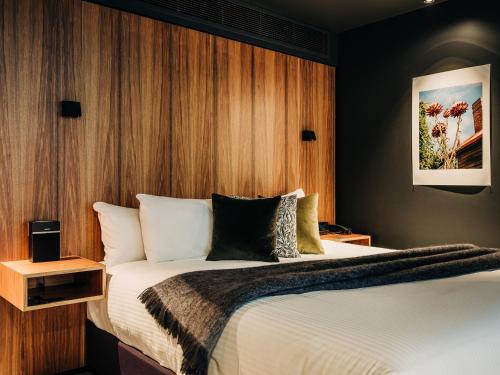 Postel nebo postele na pokoji v ubytování Moss Hotel