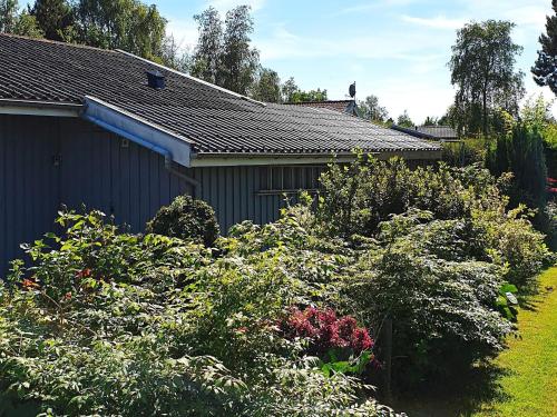 a garden in front of a house at 6 person holiday home in Sydals in Neder Lysabild