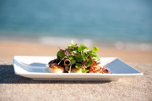 a plate of food sitting on a table at The Cricket Inn in Beesands