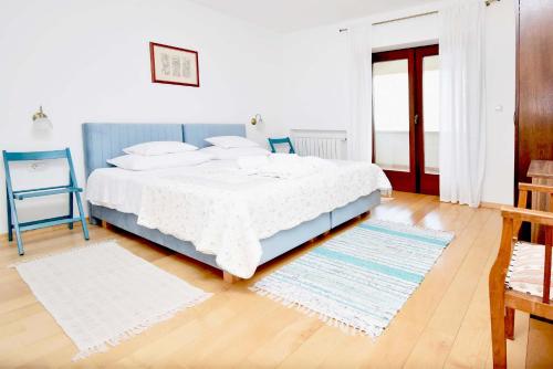 Giường trong phòng chung tại Vila Harmonia