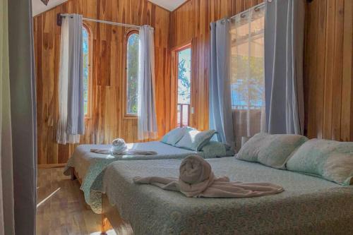 Letto o letti in una camera di Casa Monte Fresco, Monteverde