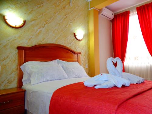 Ένα ή περισσότερα κρεβάτια σε δωμάτιο στο Hotel Pampa & Selva