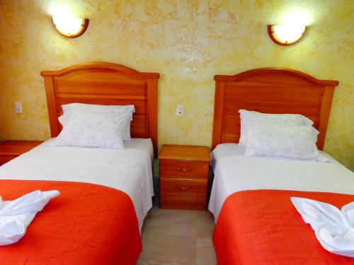 Ένα ή περισσότερα κρεβάτια σε δωμάτιο στο Hotel Pampa & Selva