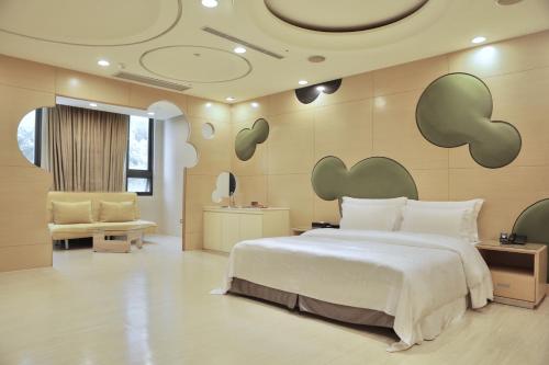 Llit o llits en una habitació de OHYA Chain Boutique Motel Taoyuan