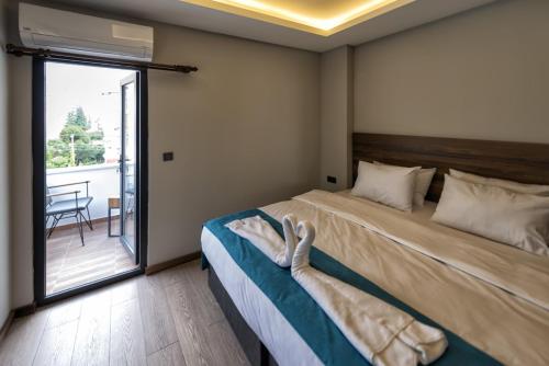 Ένα ή περισσότερα κρεβάτια σε δωμάτιο στο Ferah Suites Hotel
