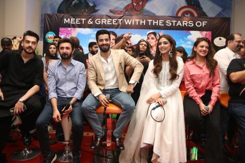 a group of people posing for a picture at Jacaranda Heights in Islamabad