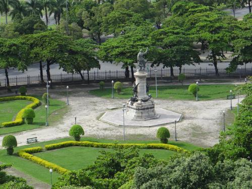 a statue in the middle of a park at Diamond Hotel in Rio de Janeiro