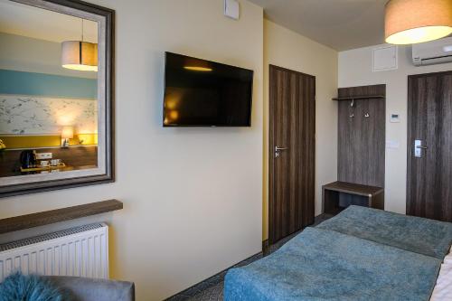 Hotel Brzozówkaにあるテレビまたはエンターテインメントセンター