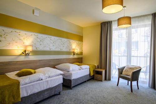 Hotel Brzozówkaにあるベッド