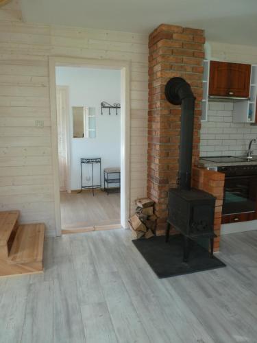 a kitchen with a stove in a room at Orle in Orle