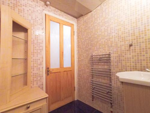 a bathroom with a sink and a toilet and a door at Luna 218 flat 3 at Marble Arch in London