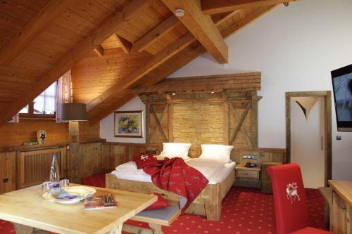 Postel nebo postele na pokoji v ubytování Hotel Mariandl - Singender Wirt
