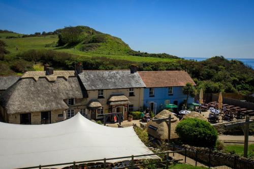 an event in front of a house with a skateboard at The Smugglers Inn in Weymouth