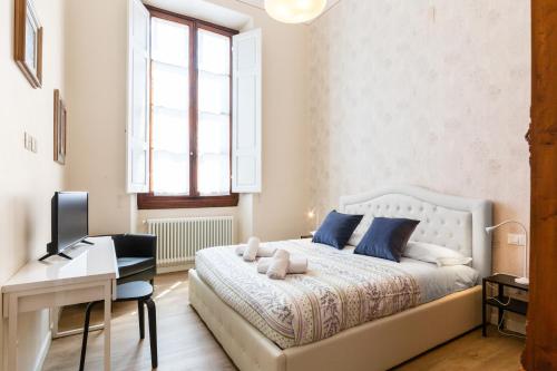 Posteľ alebo postele v izbe v ubytovaní I Renai - Ponte delle Grazie Modern Apartment