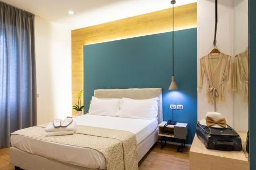 מיטה או מיטות בחדר ב-Plana Hotel