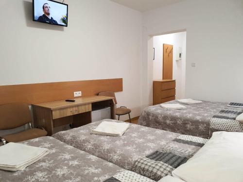 Postel nebo postele na pokoji v ubytování Astoria