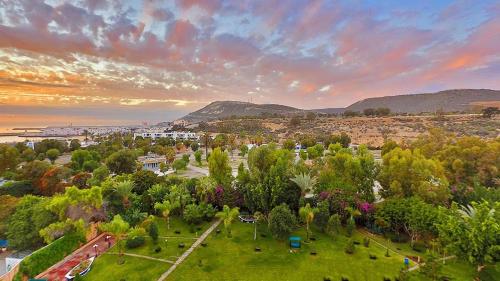 an aerial view of a park with trees and buildings at Hotel Tildi Hotel & Spa in Agadir