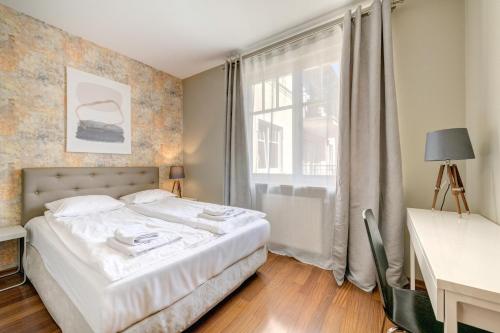 Łóżko lub łóżka w pokoju w obiekcie Dom & House - Apartamenty Patio Mare
