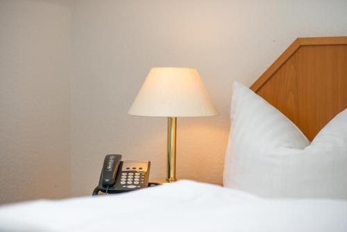 Postel nebo postele na pokoji v ubytování Trip Inn Goethe Hotel Messe