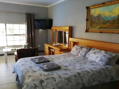 Ένα ή περισσότερα κρεβάτια σε δωμάτιο στο Wildebeespan Bed and Breakfast