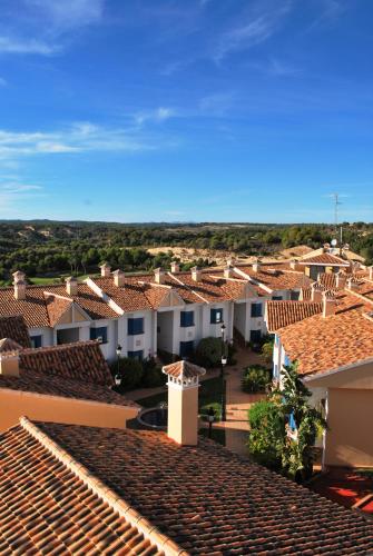 a view of a town with houses and roofs at Hotel Golf Campoamor in Dehesa de Campoamor