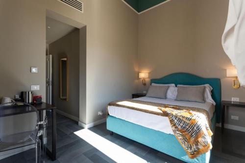 Letto o letti in una camera di Villa Masetta - Luxury Suites
