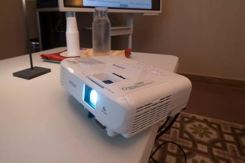 a white machine sitting on top of a table at Hotel Tonic in Palermo