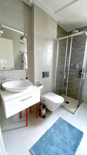 a bathroom with a sink and a toilet and a shower at Green Hills Nest La Zenia in Orihuela Costa