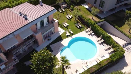 an overhead view of a house with a swimming pool at Hotel Eden in Bardolino