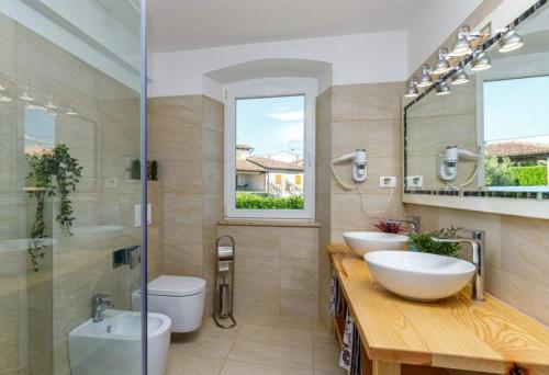 a bathroom with two sinks and a shower at Pepe&Lynn in Višnjan