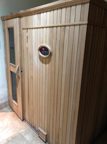 a wooden gate with a door with a window at Hacienda Don Justo Hotel Boutique Spa in Colón