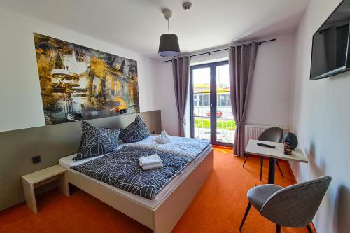 Postel nebo postele na pokoji v ubytování Pension Berlin