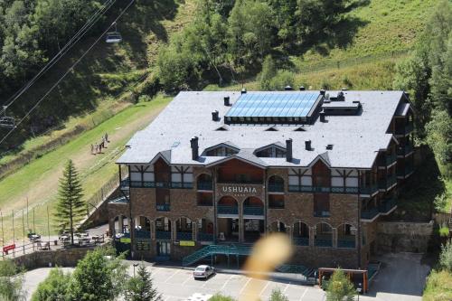 an aerial view of a building with solar panels on it at Ushuaia, The Mountain Hotel in Arinsal
