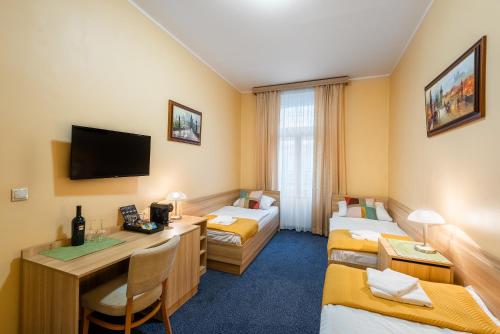 Postel nebo postele na pokoji v ubytování Hotel Libero