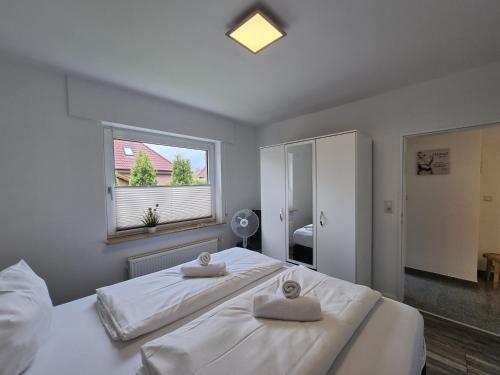 Postel nebo postele na pokoji v ubytování Ferienwohnung Westwind